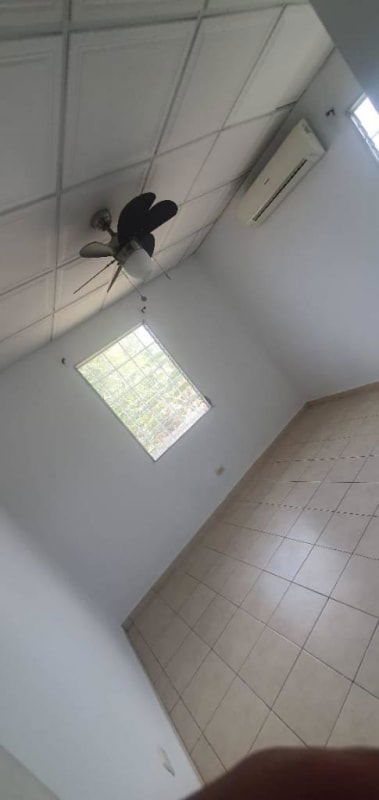 Bedroom or office space with tiled floor window with bars air conditioning Portofino