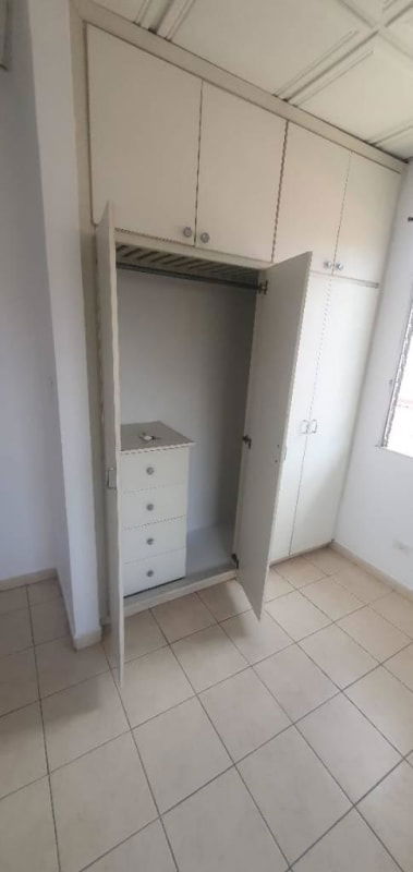 Bedroom with built-in wardrobe balcony access tiled floor Villa Zaita Portofino