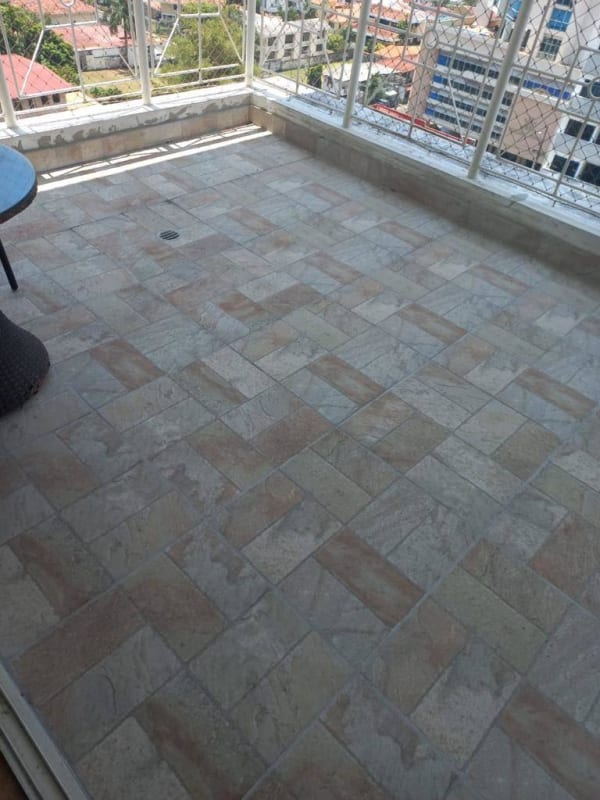 Kitchen area equipped with stove and refrigerator in PH Friso Real apartment Panama City