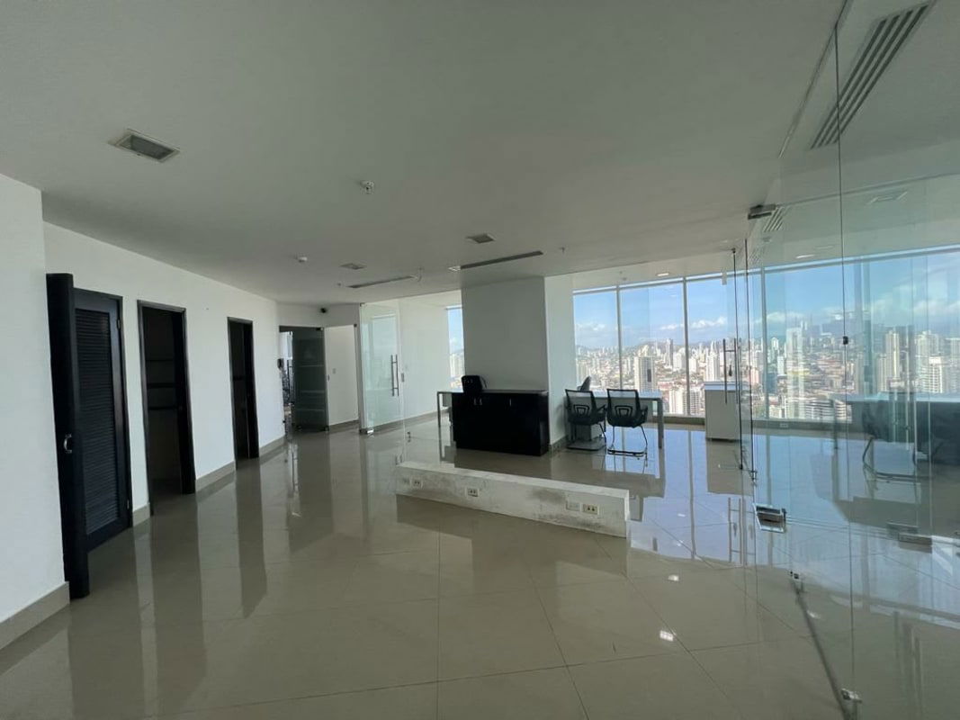 Office interior with glass partitions floor-to-ceiling windows in F&F Tower Panama