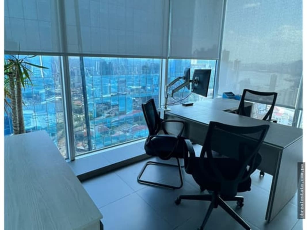 Office interior with floor to ceiling windows and city skyline view at Oceania Business Plaza Panama