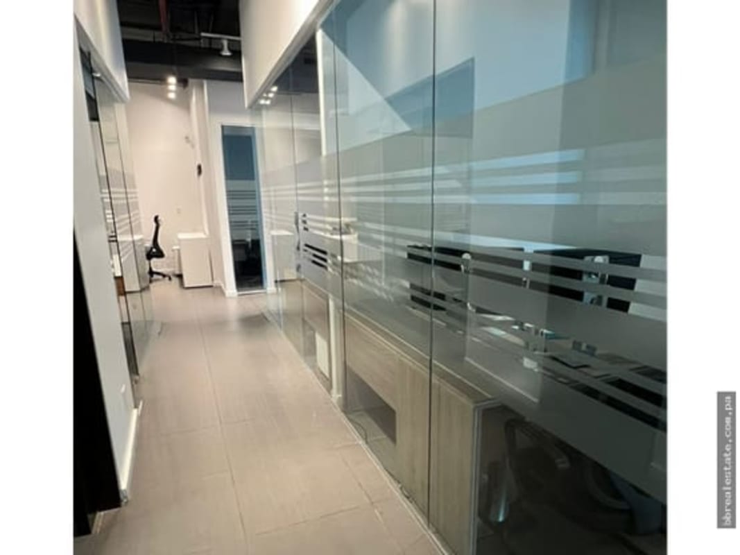 Bright private office with glass partitions and modern furniture in Punta Pacifica Oceania Plaza Panama