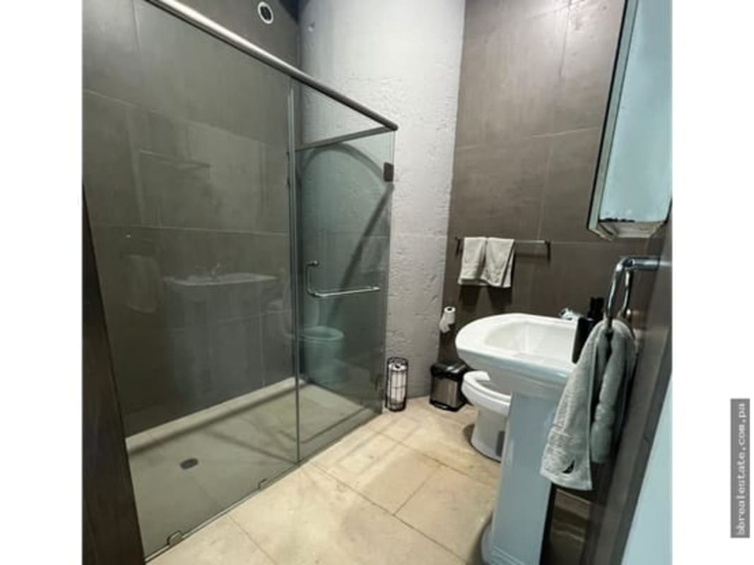 Modern bathroom with glass shower enclosure inside office space Oceania Business Plaza Panama