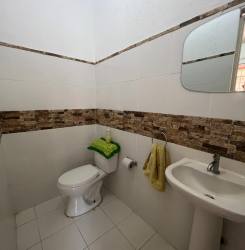 White one-story home with porch, garden and parking space Rancho Los Sueños Chame Panama