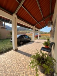 Compact bathroom with shower, pedestal sink, mirror and modern fixtures Rancho Los Sueños Panama