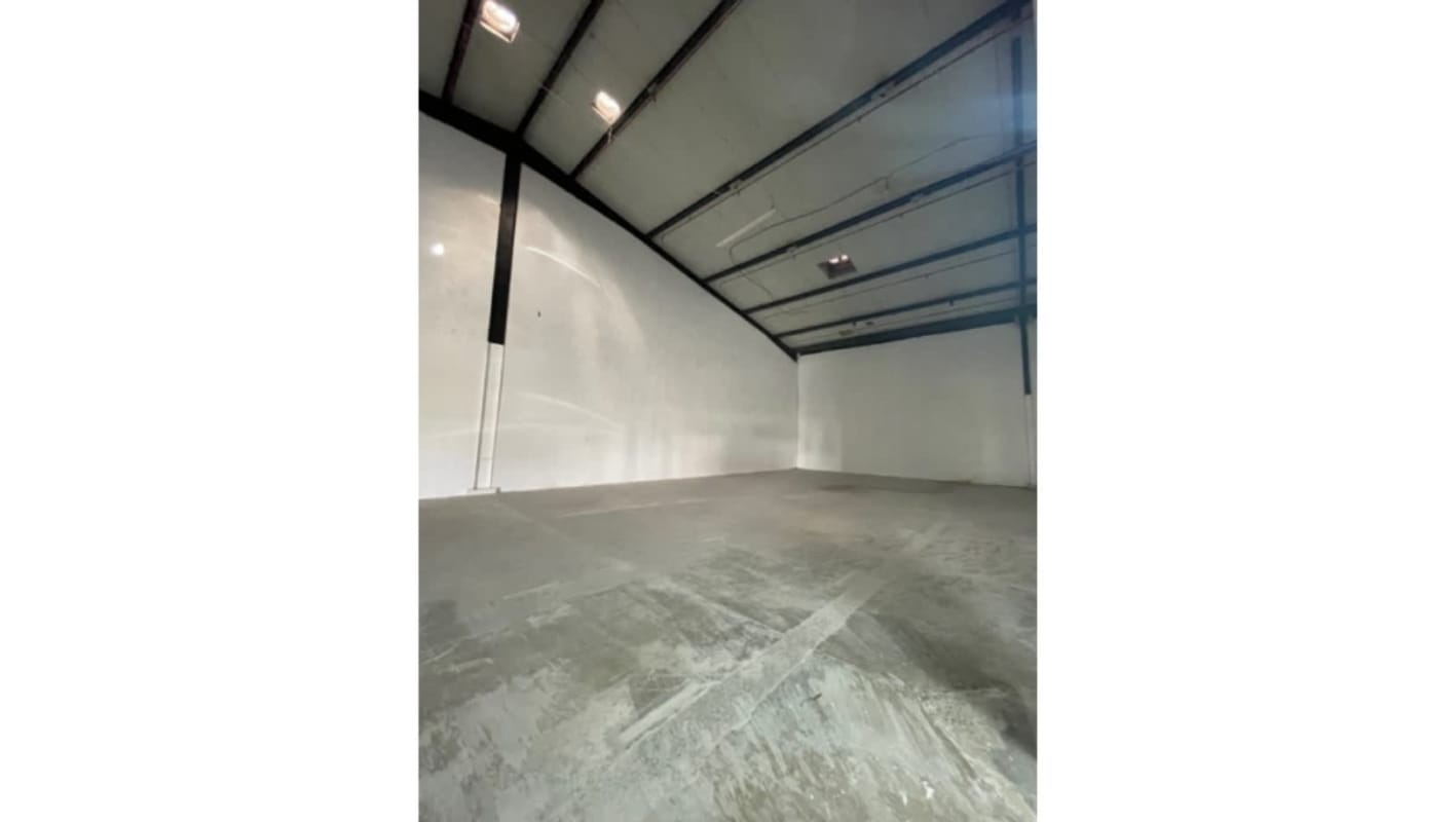 Spacious empty industrial warehouse interior with high vaulted ceiling in Panama