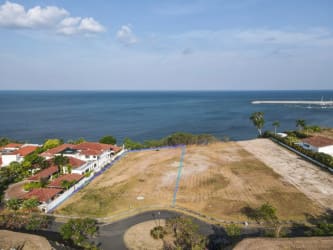 Aerial shot of oceanfront vacant land lot overlooking Pacific Ocean in Vista Mar golf marina community Panama