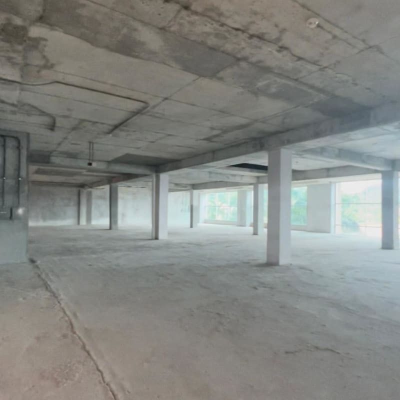 Raw concrete open space with floor to ceiling windows in Paseo Albrook Mall Panama