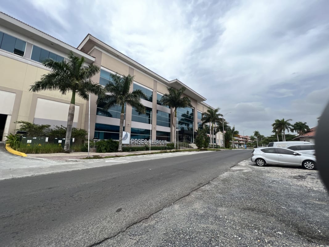 Open lobby with planters, tiled floor, natural light at Paseo Albrook commercial center Panama