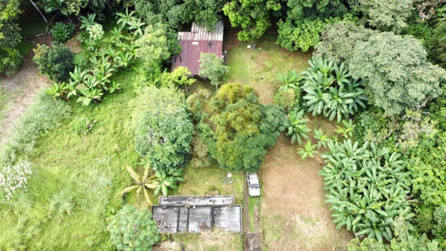 Aerial tropical land parcel with rustic construction Las Cumbres Panama