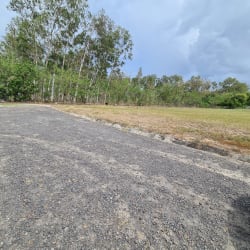 Cleared vacant land with gravel road and tree borders Punta Chame Panama