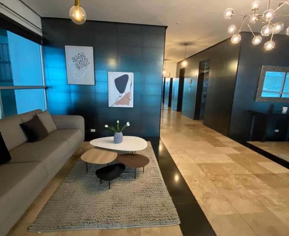Bright living room with city view windows in PH Park City condo El Cangrejo Panama
