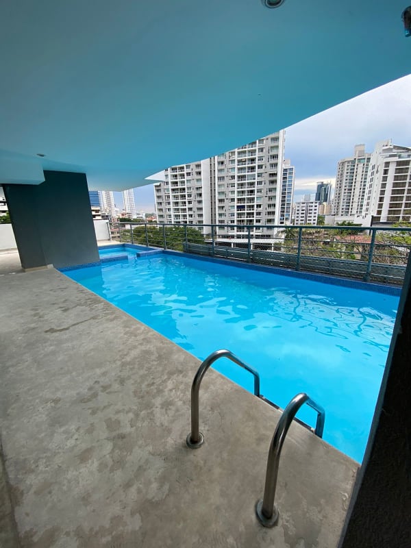 Elevated rooftop swimming pool with panoramic city skyline PH Park City Panama City
