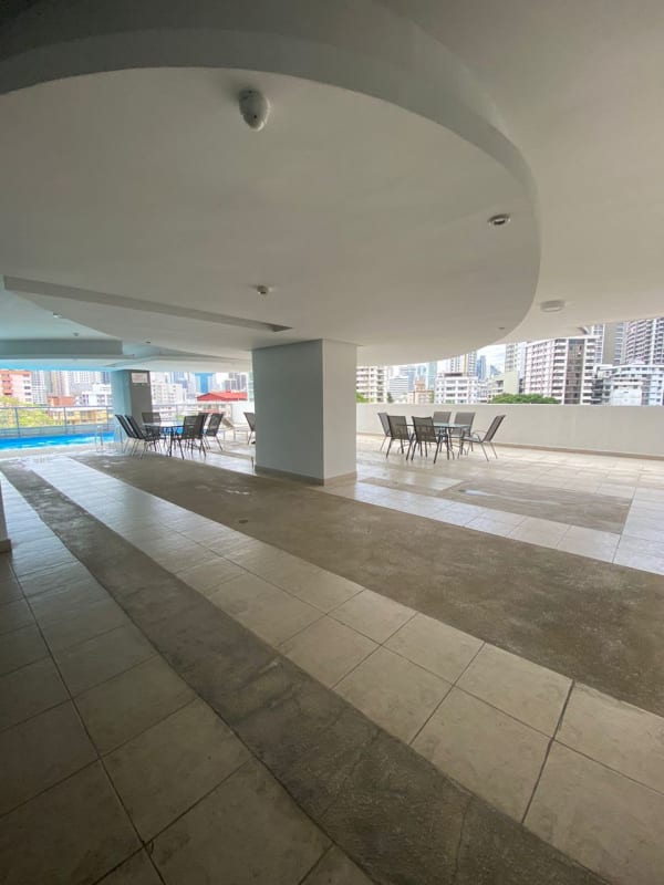 Covered outdoor lounge terrace with seating and pool PH Park City El Cangrejo Panama