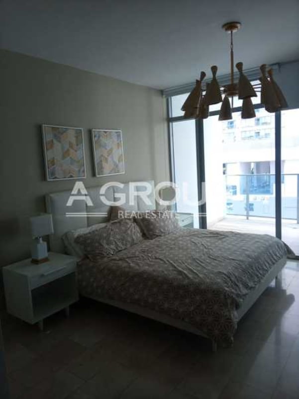 Granite countertop kitchen with stainless appliances at Grand Tower Punta Pacífica Panama City Real estate