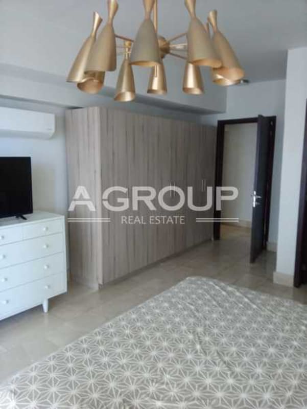 Master bedroom with floor-to-ceiling windows and Pacific Ocean views in Grand Tower Panama