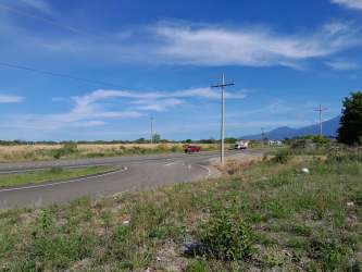 Curved road through mountain countryside near vacant land in El Francés Boquete Panama