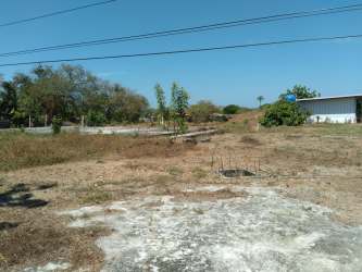Blue water tank on metal platform and utility shed on large lot Guararé Panama