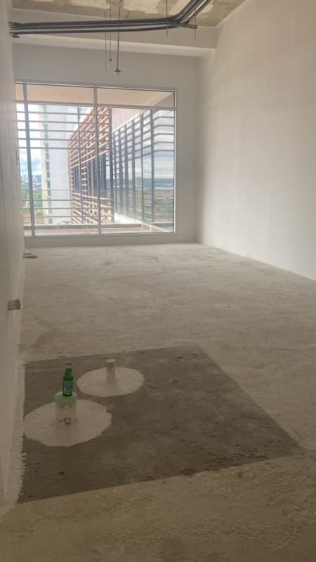 Unfinished office space with large windows facing Costa del Este skyline