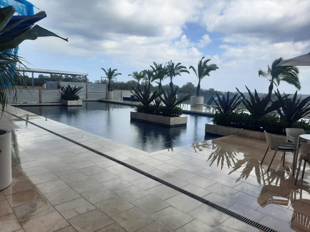 Modern open kitchen with quartz countertops and stainless appliances in The Reserve Santa Maria Panama