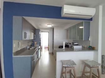 Kitchen with granite countertops, stainless appliances in PH Ocean II Playa Blanca Panama