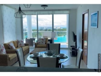 Spacious balcony overlooking ocean waves and lagoon at PH Waterways Playa Blanca Panama