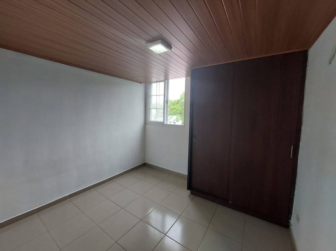 Modern bathroom with glass-enclosed shower, decorative tile accent in Villa Lorena Apartment Panama City