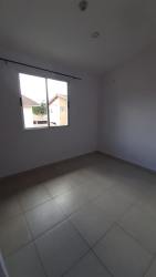 Bedroom with large window and ceramic tile floors in Villas de Aragón Arraiján Panama