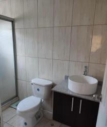 Bathroom with glass shower enclosure, vessel sink and tile design Colinas del Oeste house Panama
