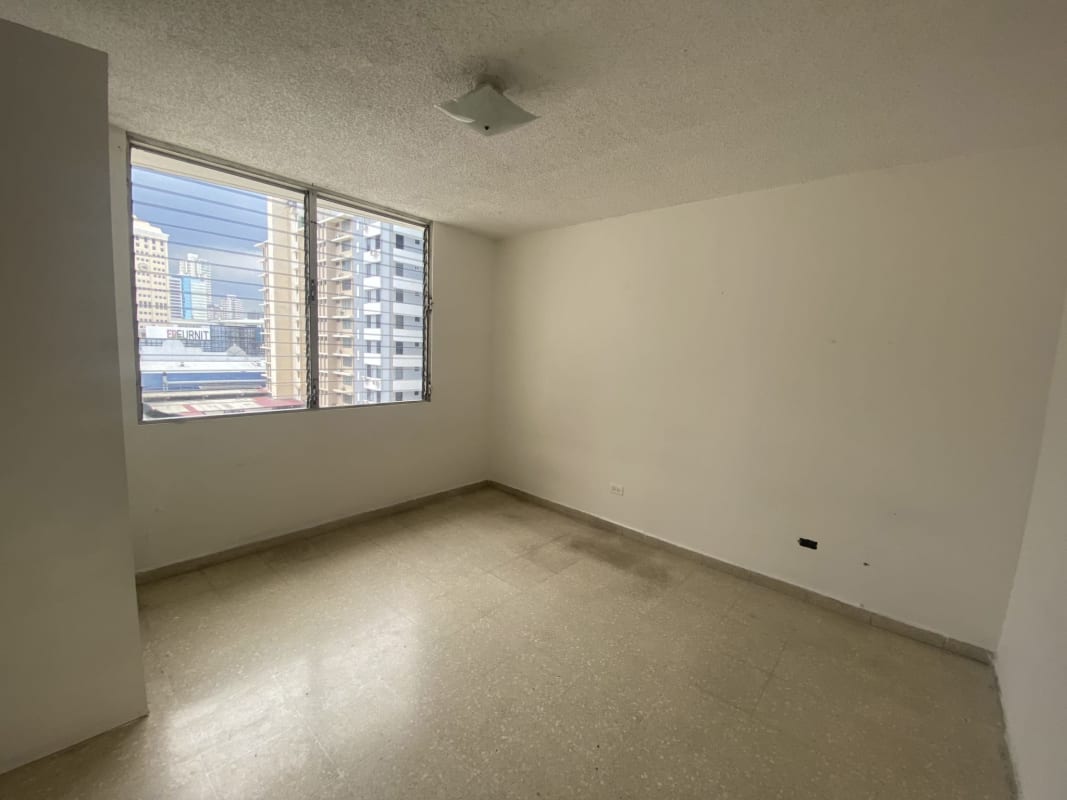 Bedroom with large window, textured ceiling, tile floors in PH Monaco Obarrio Panama