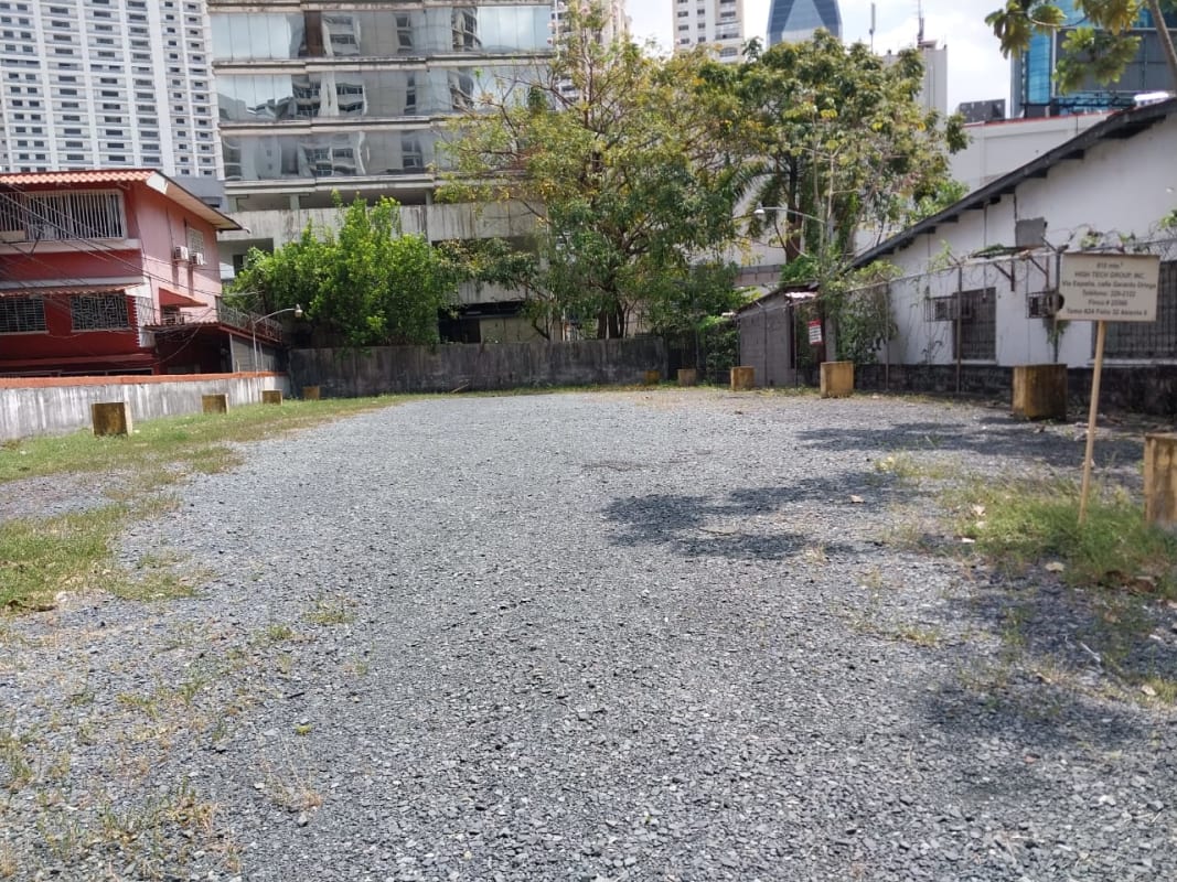 Vacant fenced lot surrounded by mixed-use buildings Via España Panama City