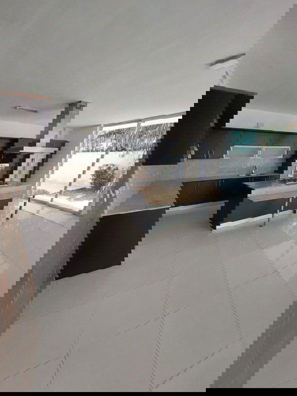 Spacious walk-in closet with wooden shelves and drawers in PH Costa Esmeralda Costa Sur Panama City