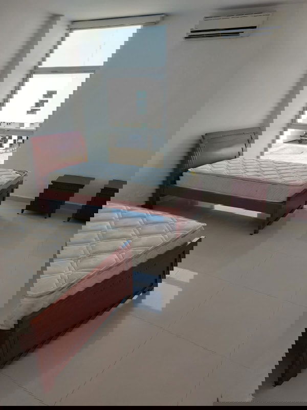 Modern kitchen with granite counters, island cooktop and sliding doors in Costa Sur Panama home