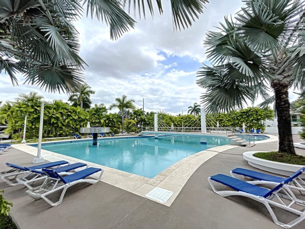 Bedroom with built-in wooden wardrobe, shelves in PH Costa Esmeralda Panama City