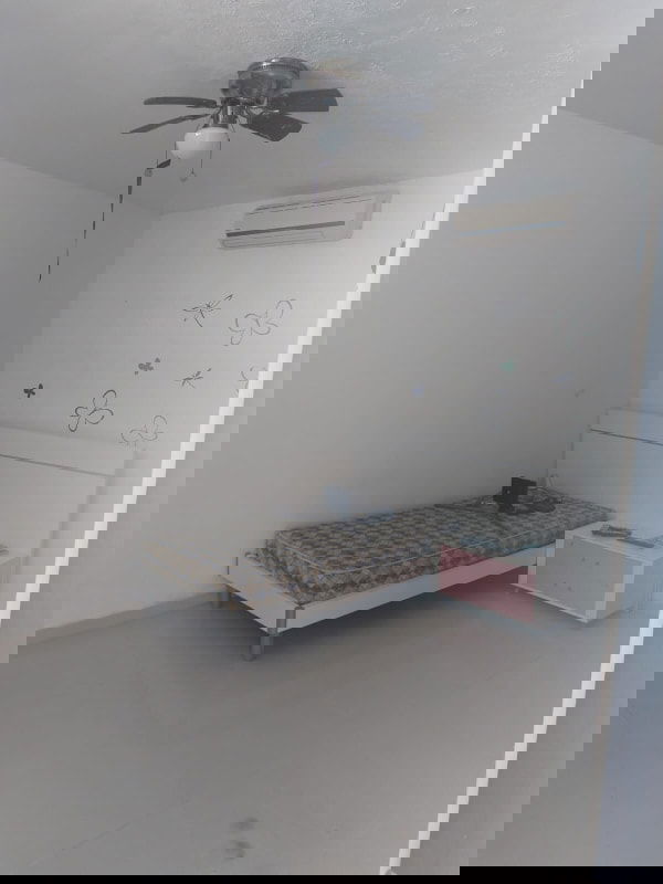 Stylish modern living room with floating staircase and accent wall in Costa Sur Panama