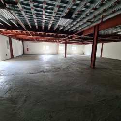 Interior of large empty warehouse with mezzanine offices Coronado Panama Oeste