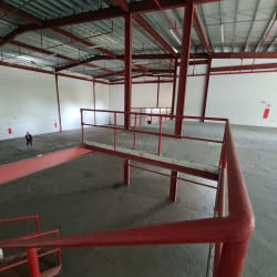 Warehouse floor area with high ceilings steel supports and mezzanine offices Coronado Panama