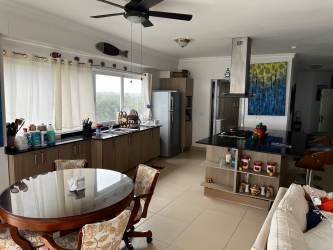 Contemporary equipped kitchen with natural light in beachfront Playa Blanca apartment