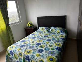 Modern foyer with decorative mirror and console table in beachfront condo Panama