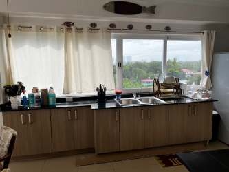 Elegant air-conditioned lobby with plants at beachfront condo Playa Blanca