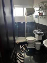 Open kitchen dining combo with bright windows in beachfront Playa Blanca rental Panama