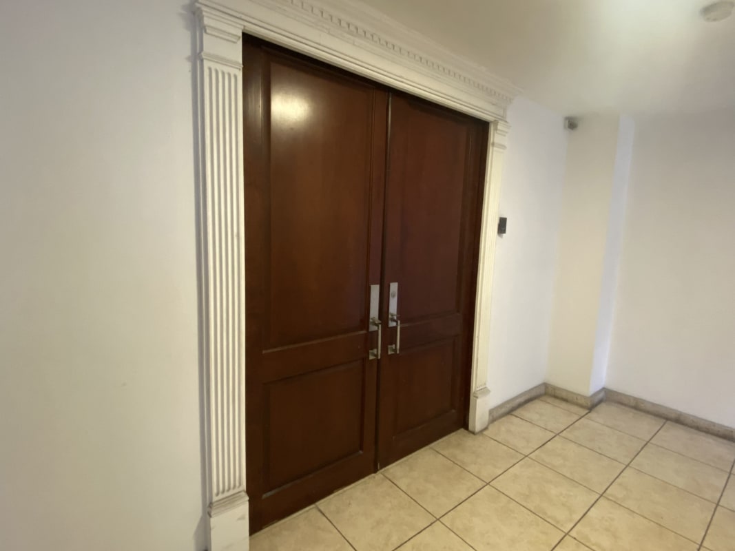 Main entryway double wooden doors PH Plaza 50 office for sale in Obarrio Panama City