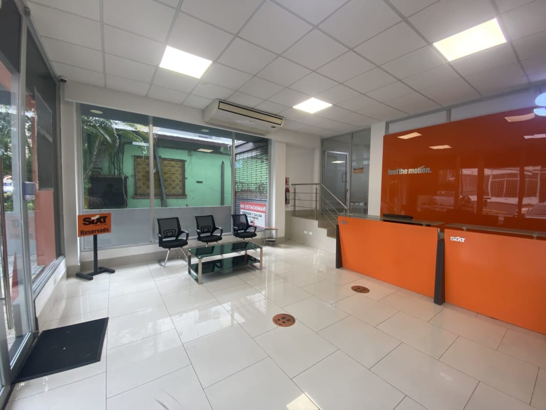 Modern reception area orange accent glass doors PH El Cangrejo Business Complex Panama City