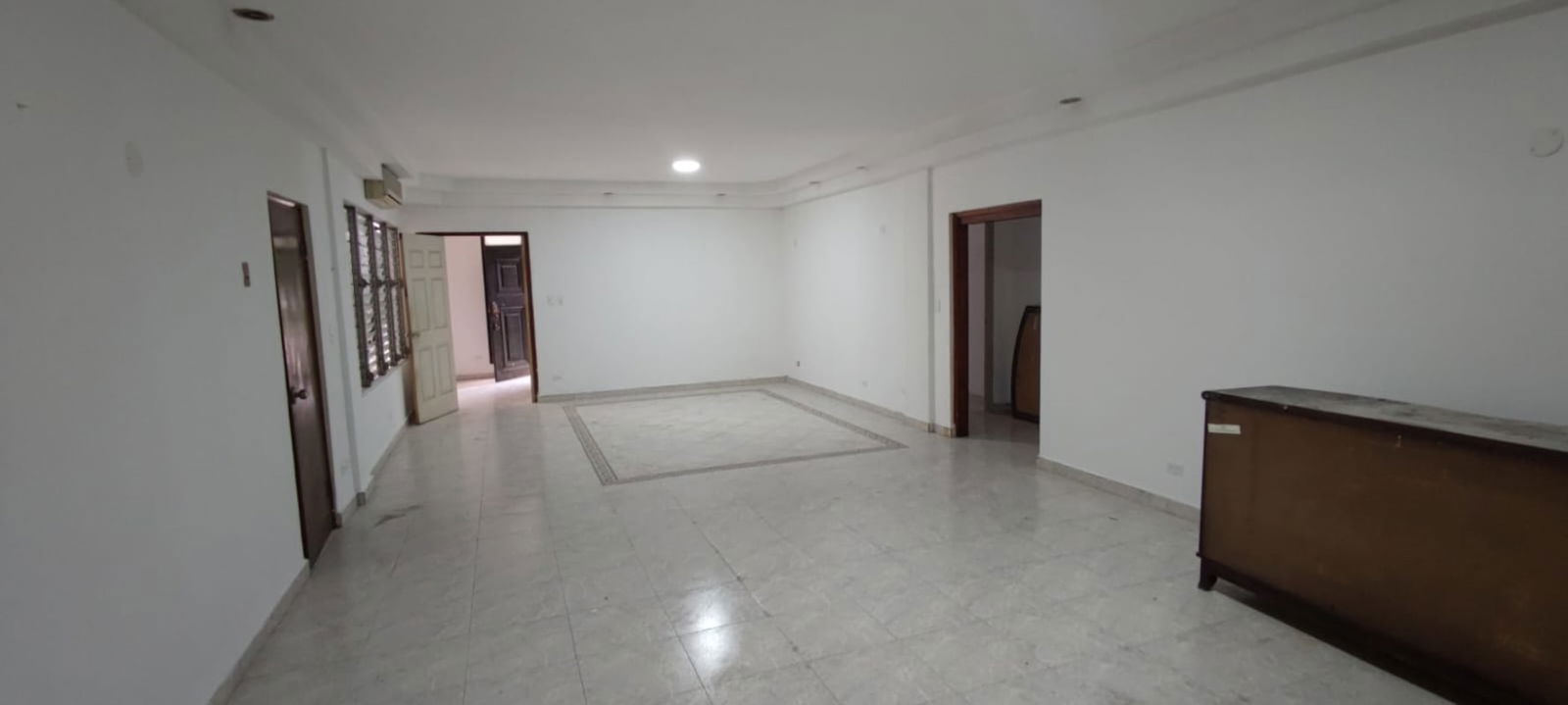 Bright bedroom with large window and wardrobe in Casa Dudley Obarrio Panama City