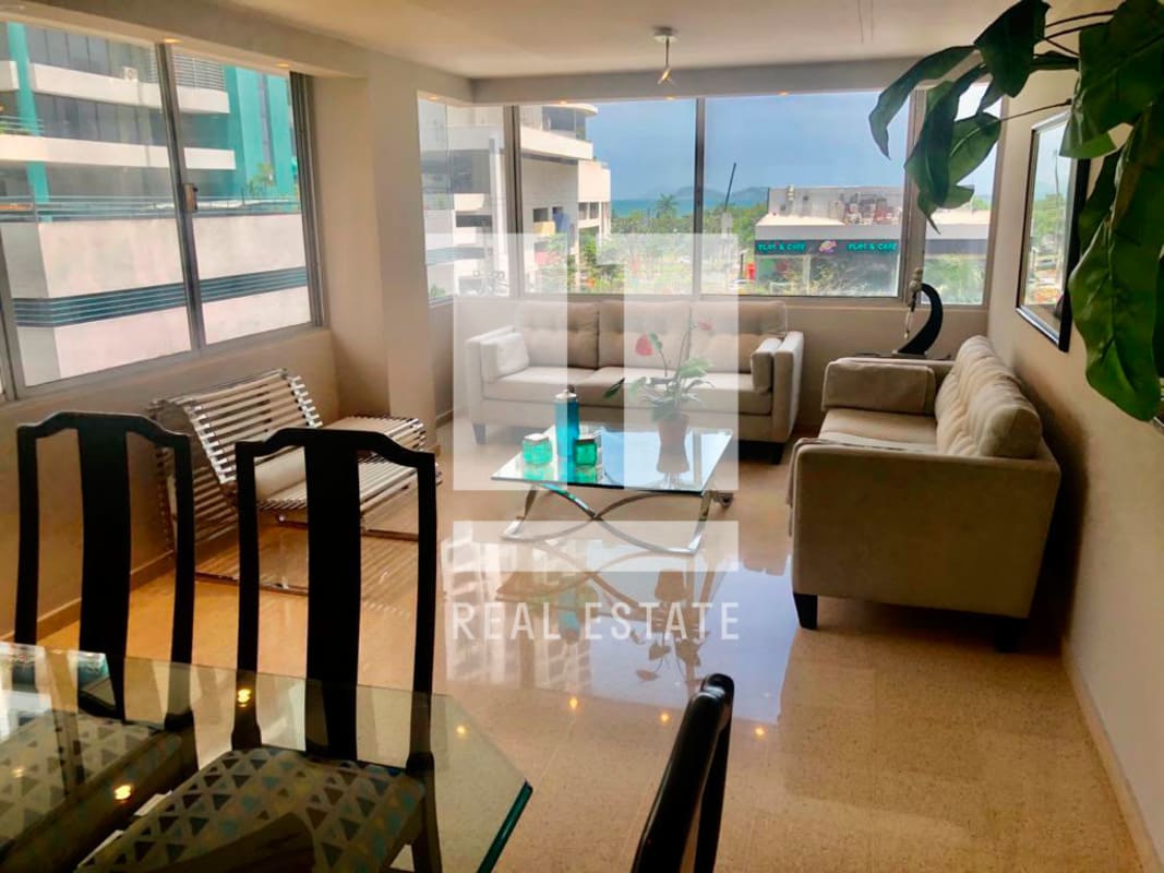 Modern open-plan living and dining room with balcony PH Parque Marbella Panama