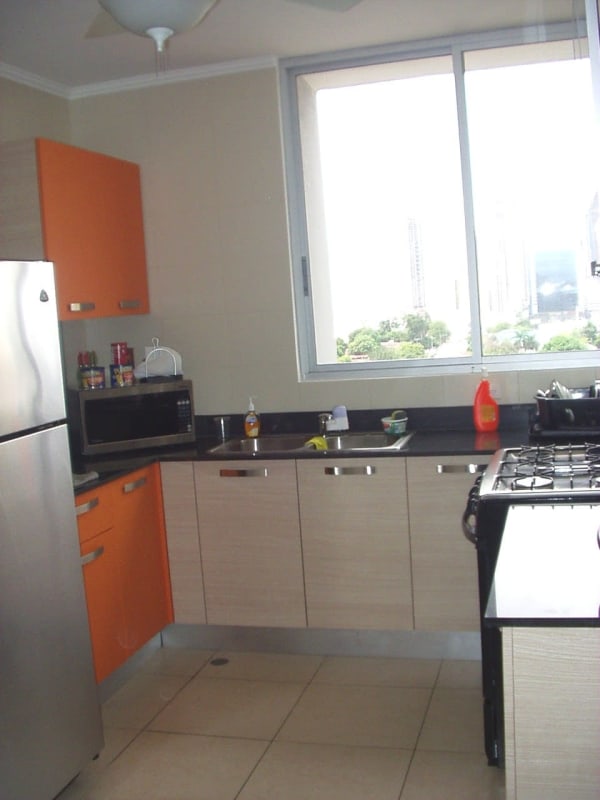 Kitchen with modern cabinetry, stainless appliances, and large window at PH San Francisco 67 Panama