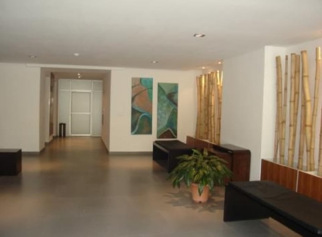 Outdoor swimming pool with lounge chairs and skyline view at PH San Francisco 67 Panama