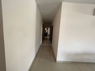 Wide tile corridor with built-in wardrobes in PH River Valley apartment Panama Pacifico