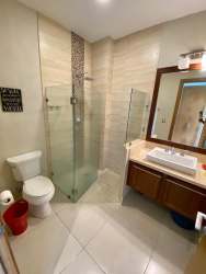 Spacious master suite with terrace access, ceiling fan, modern décor Casamar San Carlos Panama