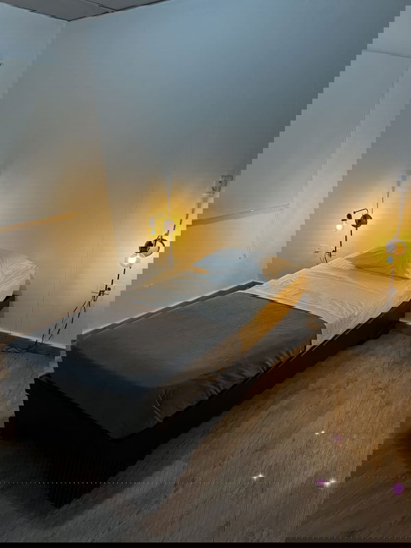 Bedroom with modern light fixtures and tile floors in PH Perejil Panama